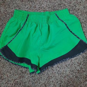 Green running shorts
